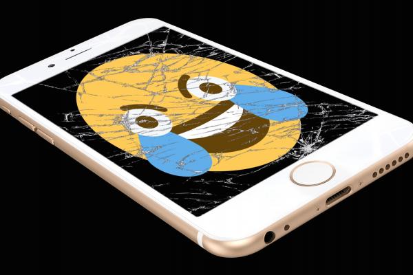 Smiley with tears on broken smart phone screen